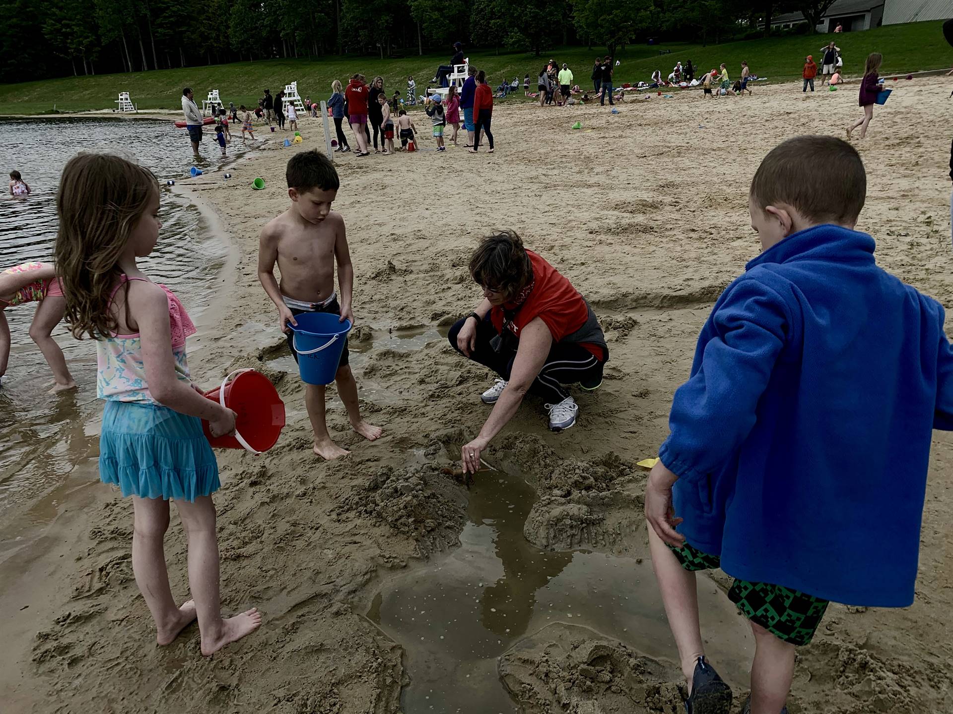 4 students creating a sand mote.