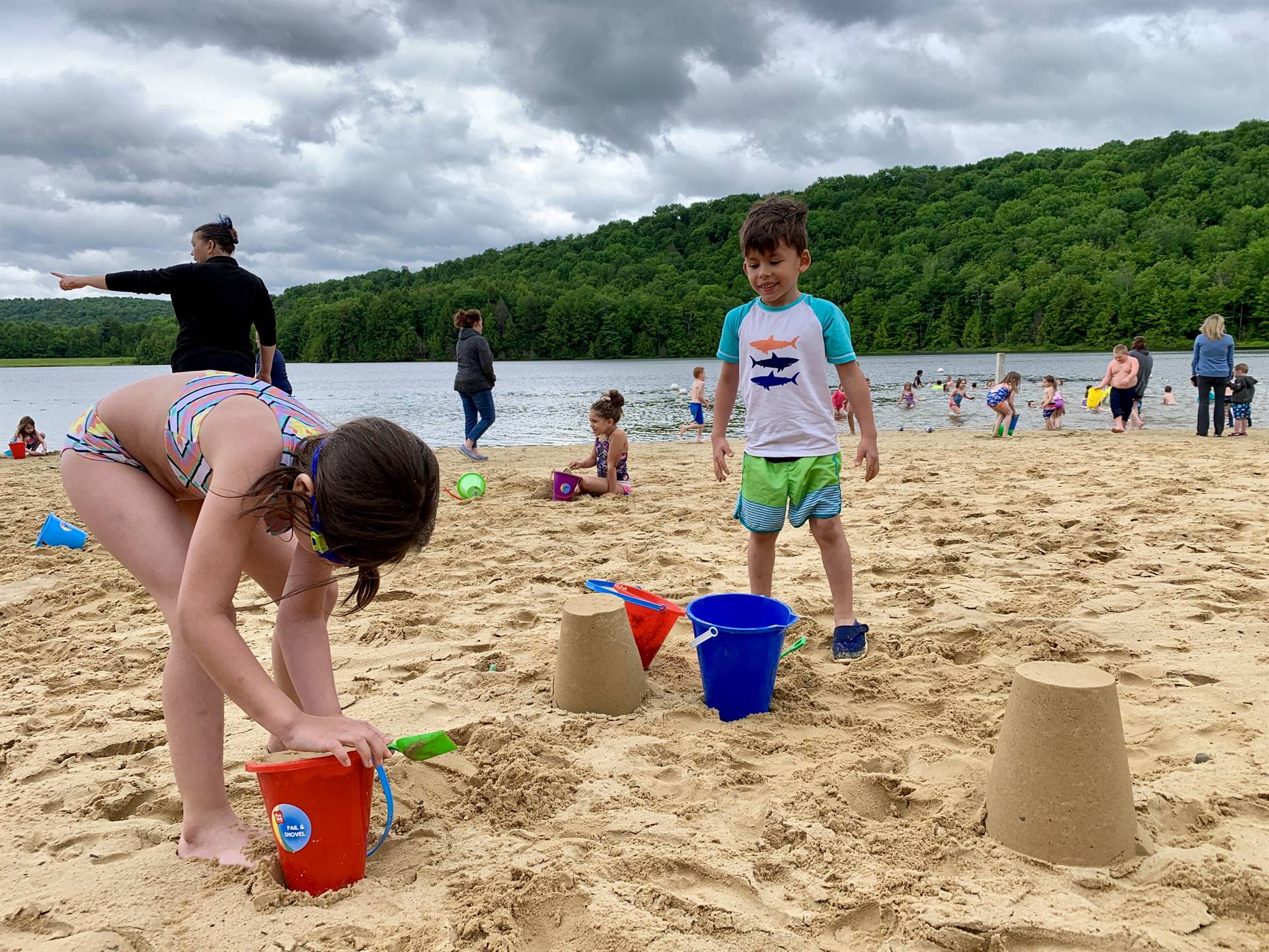 Students play in the sand.