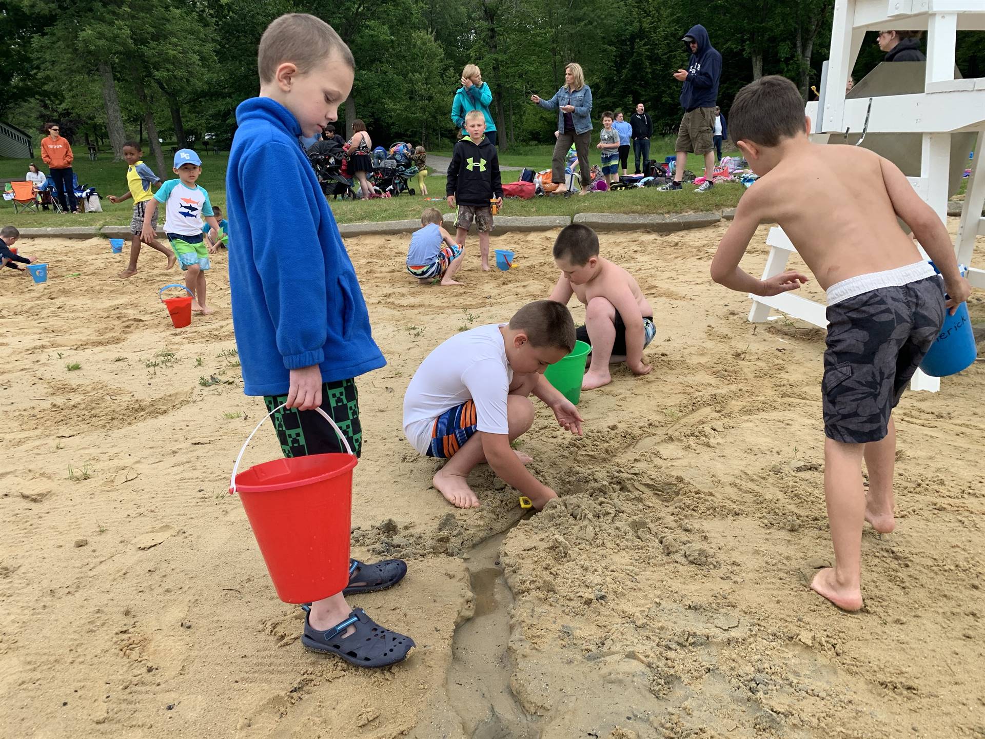 Students play in sand at Cole Park.