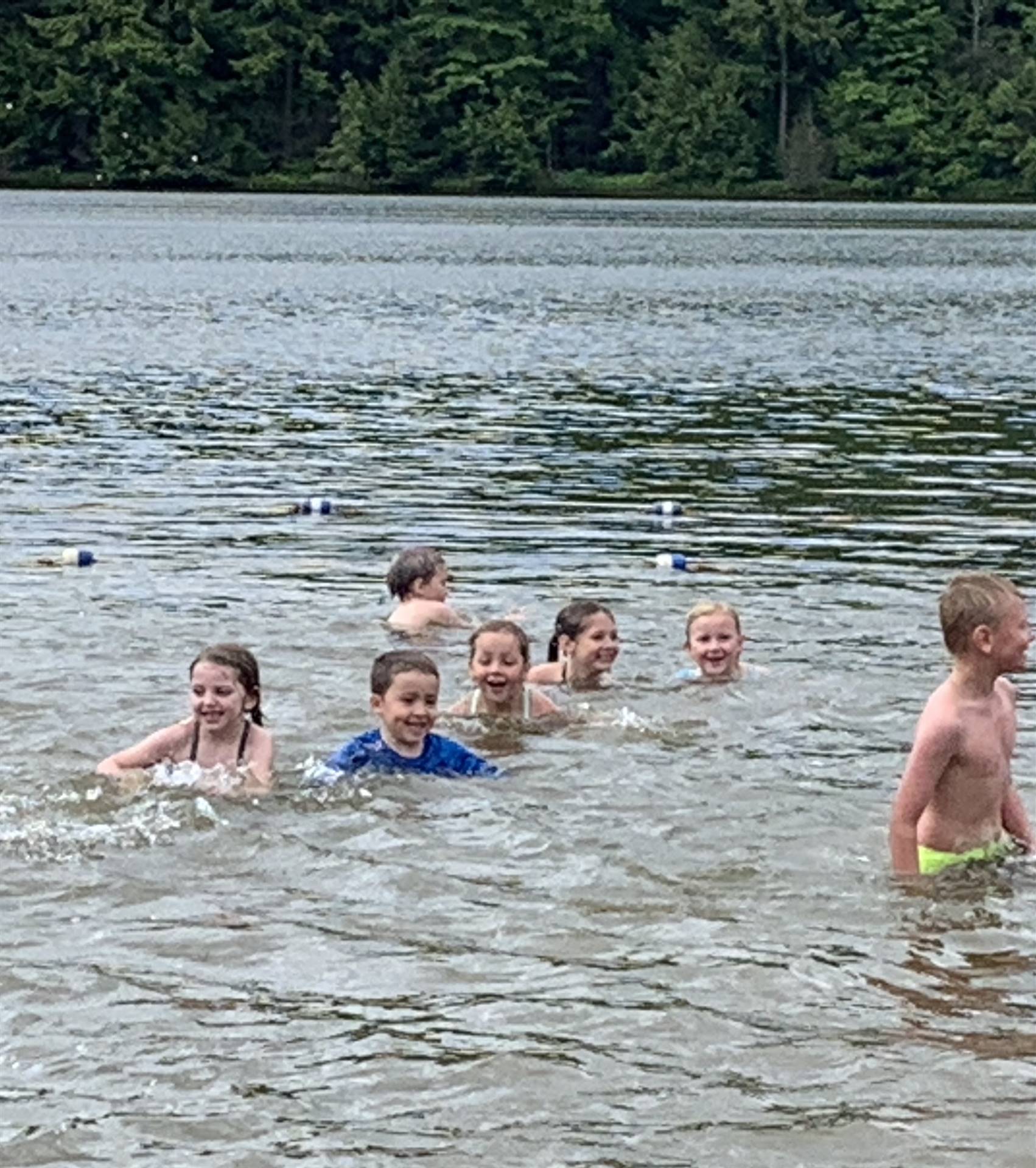 Students swim in water at Cole Park.