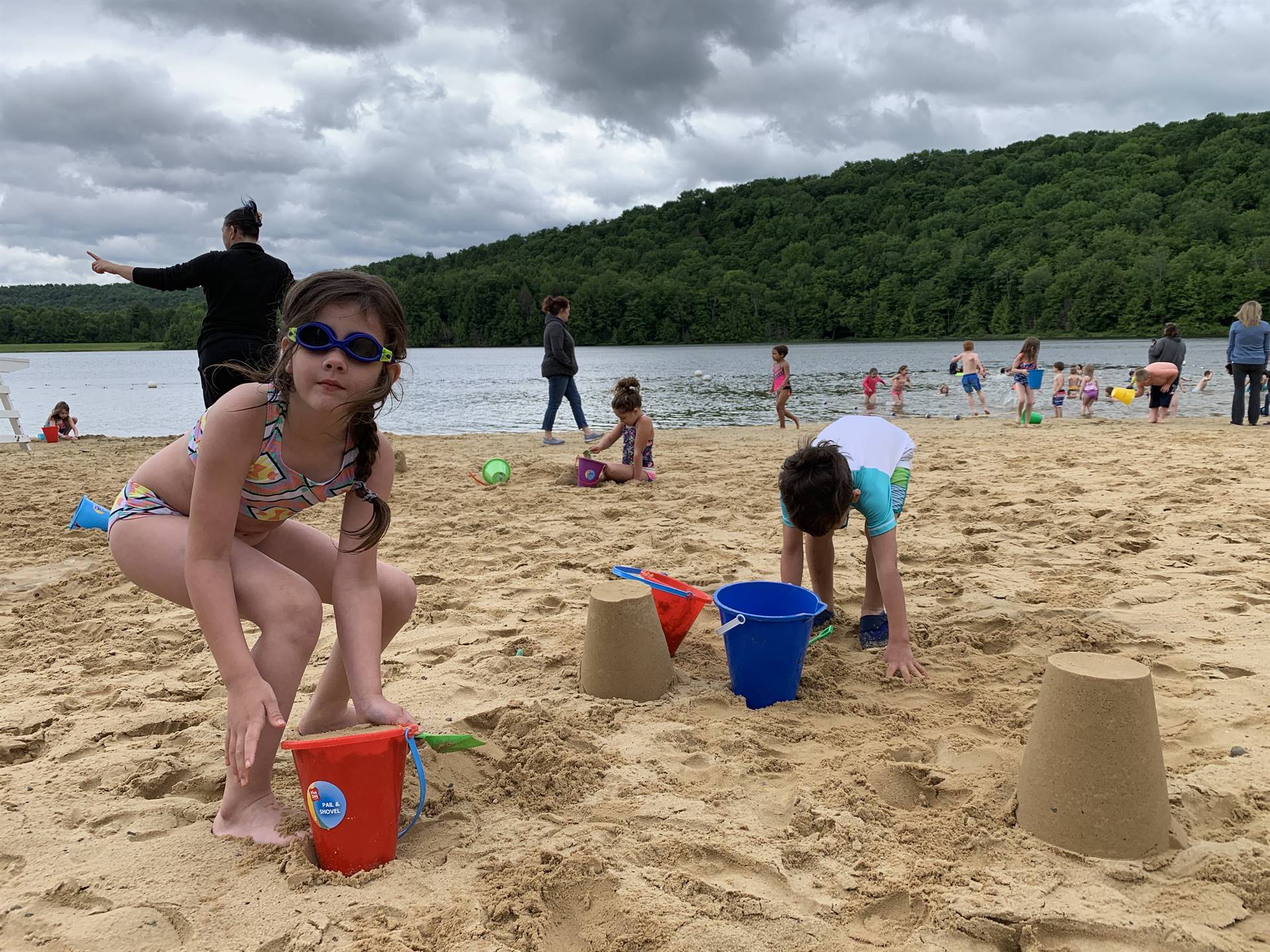 students build sand castles in sand.