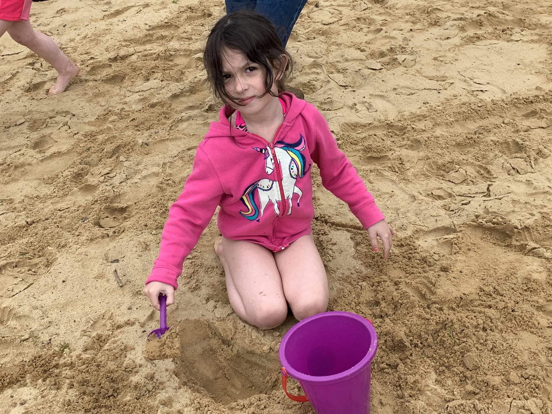 1 student builds a sand castle.