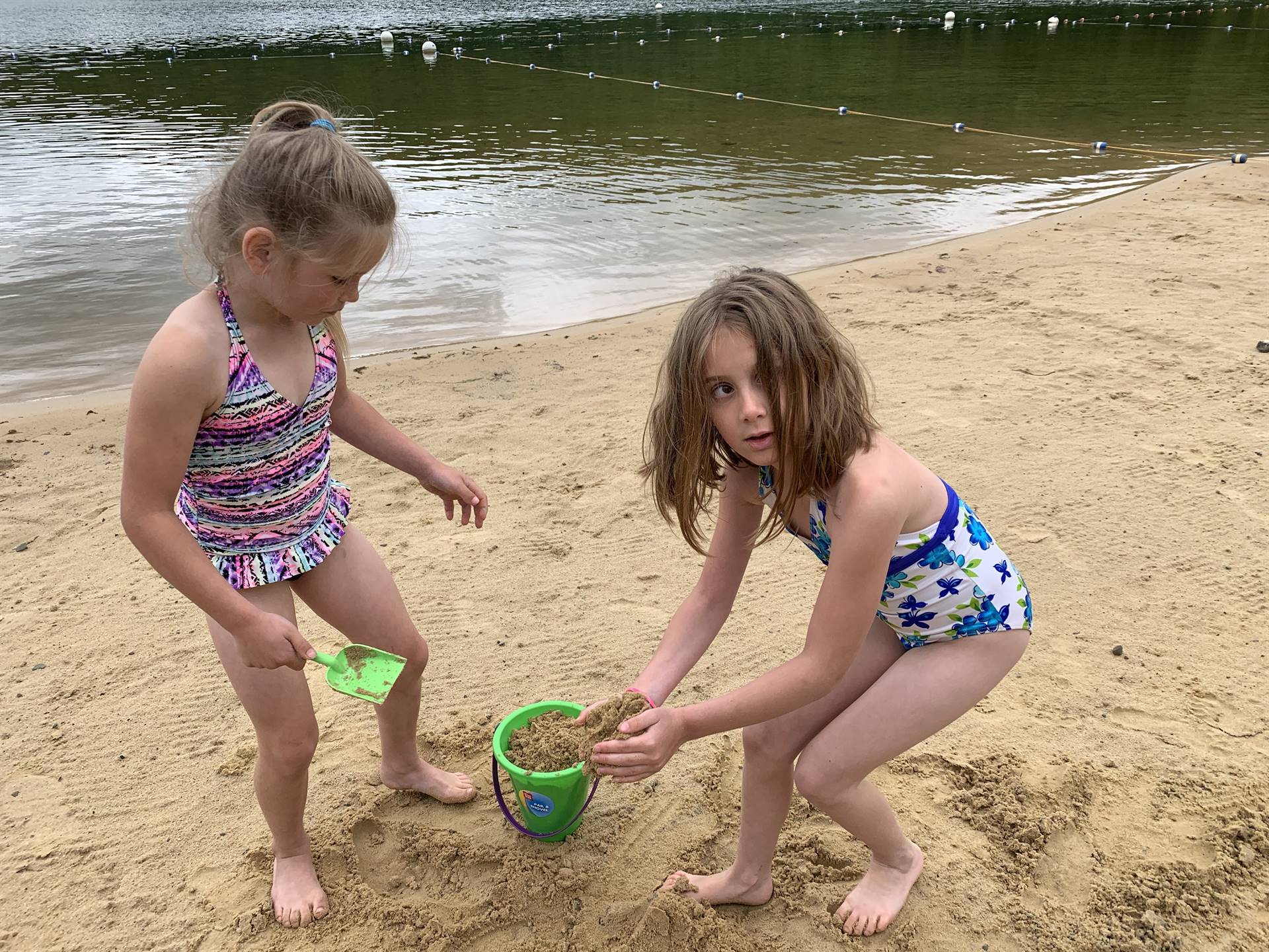 2 students in sand.