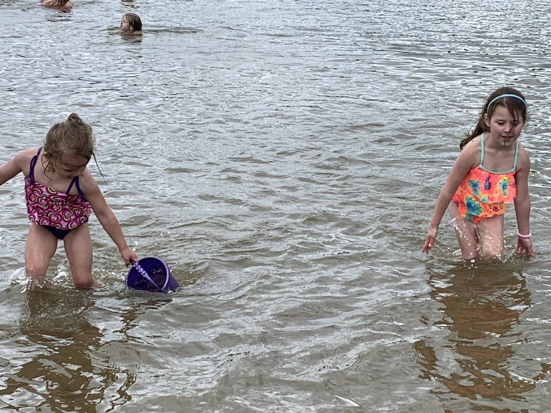 2 children playing water.