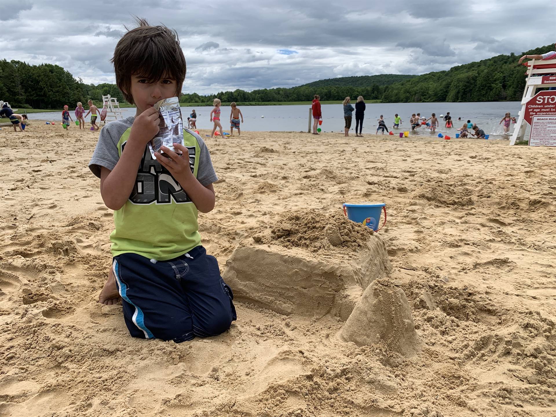 A student shows his sand castle!