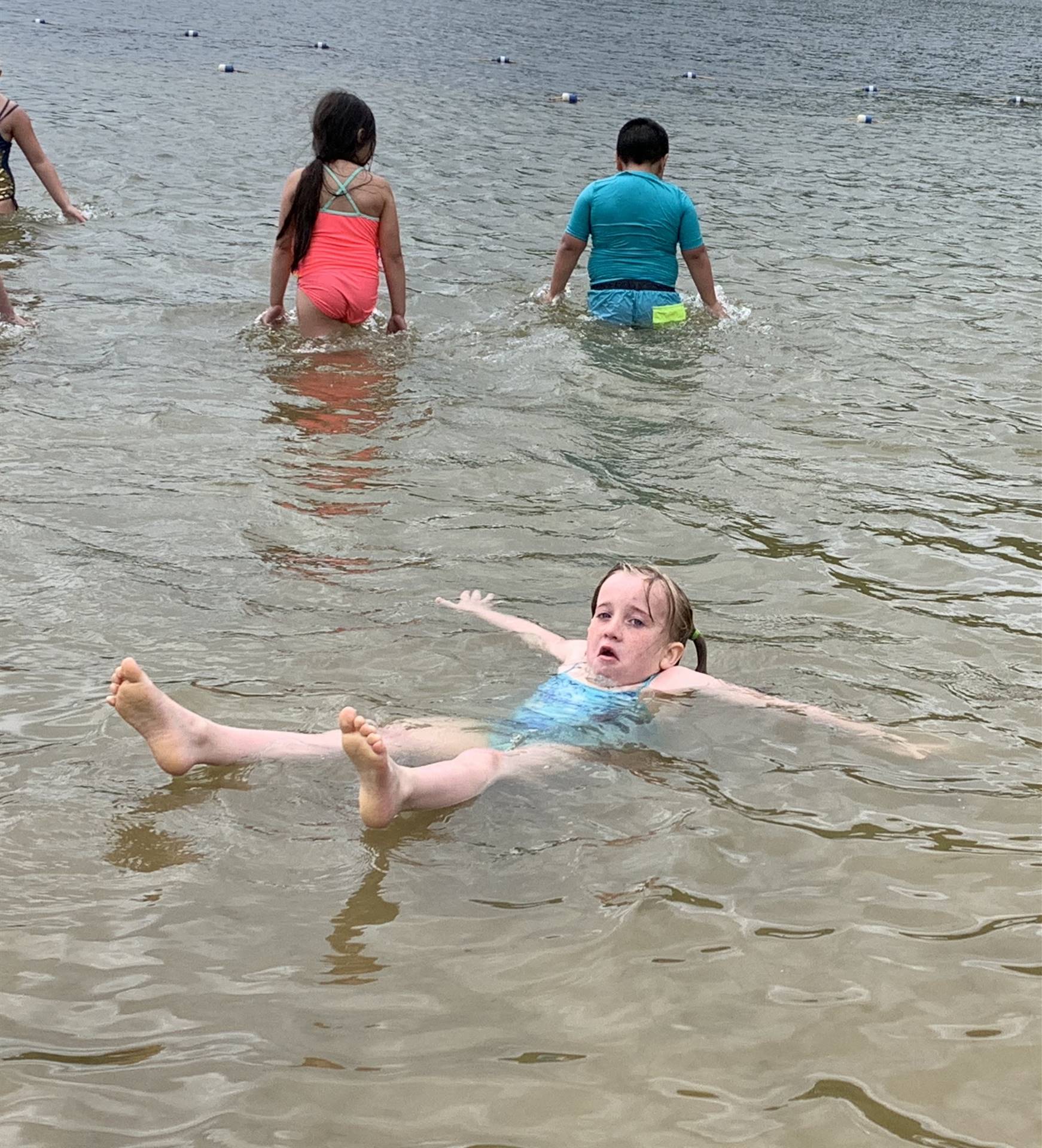 A student floating in water
