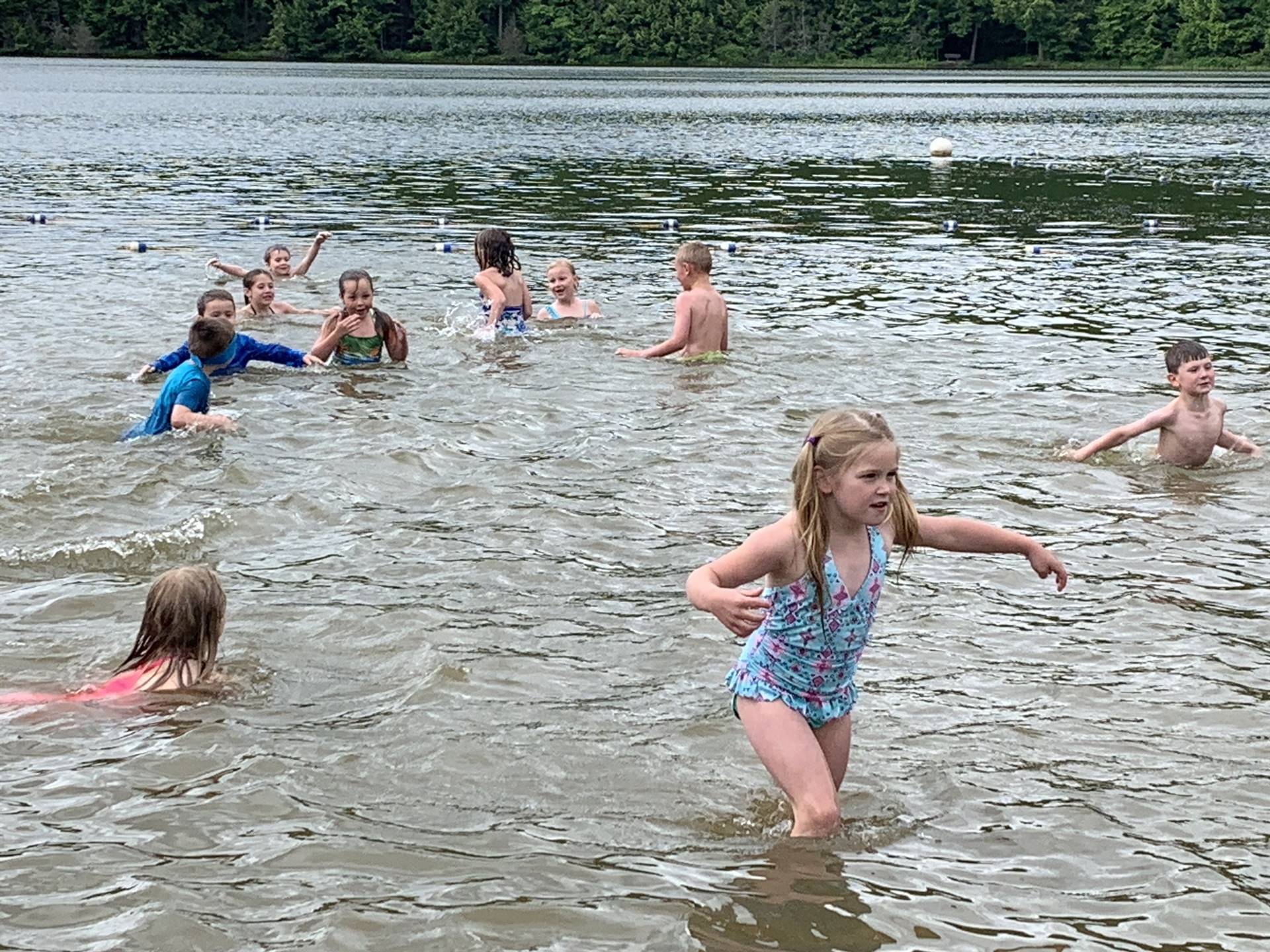 students in lake.