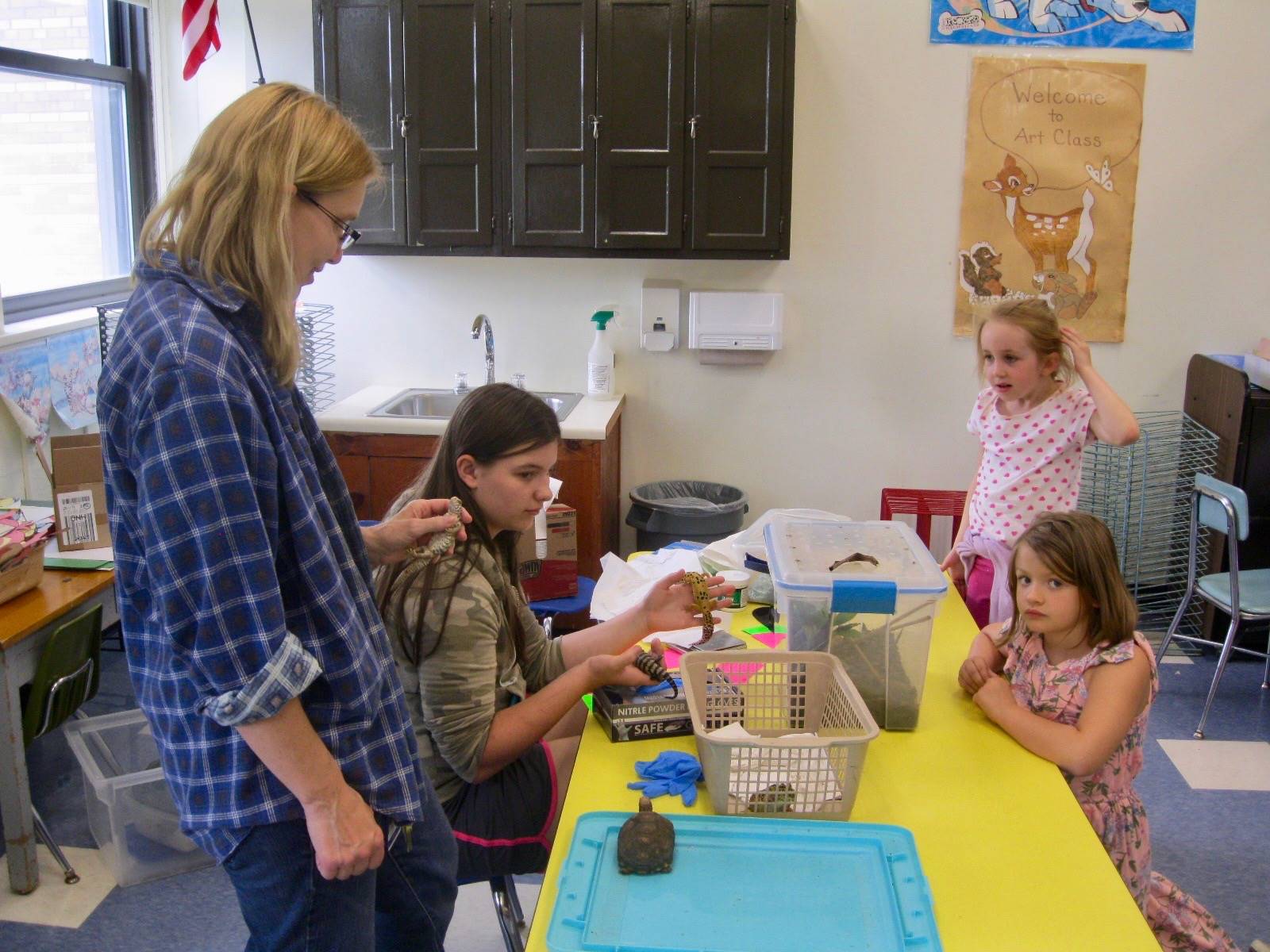 Custodian brings her reptiles to visit.