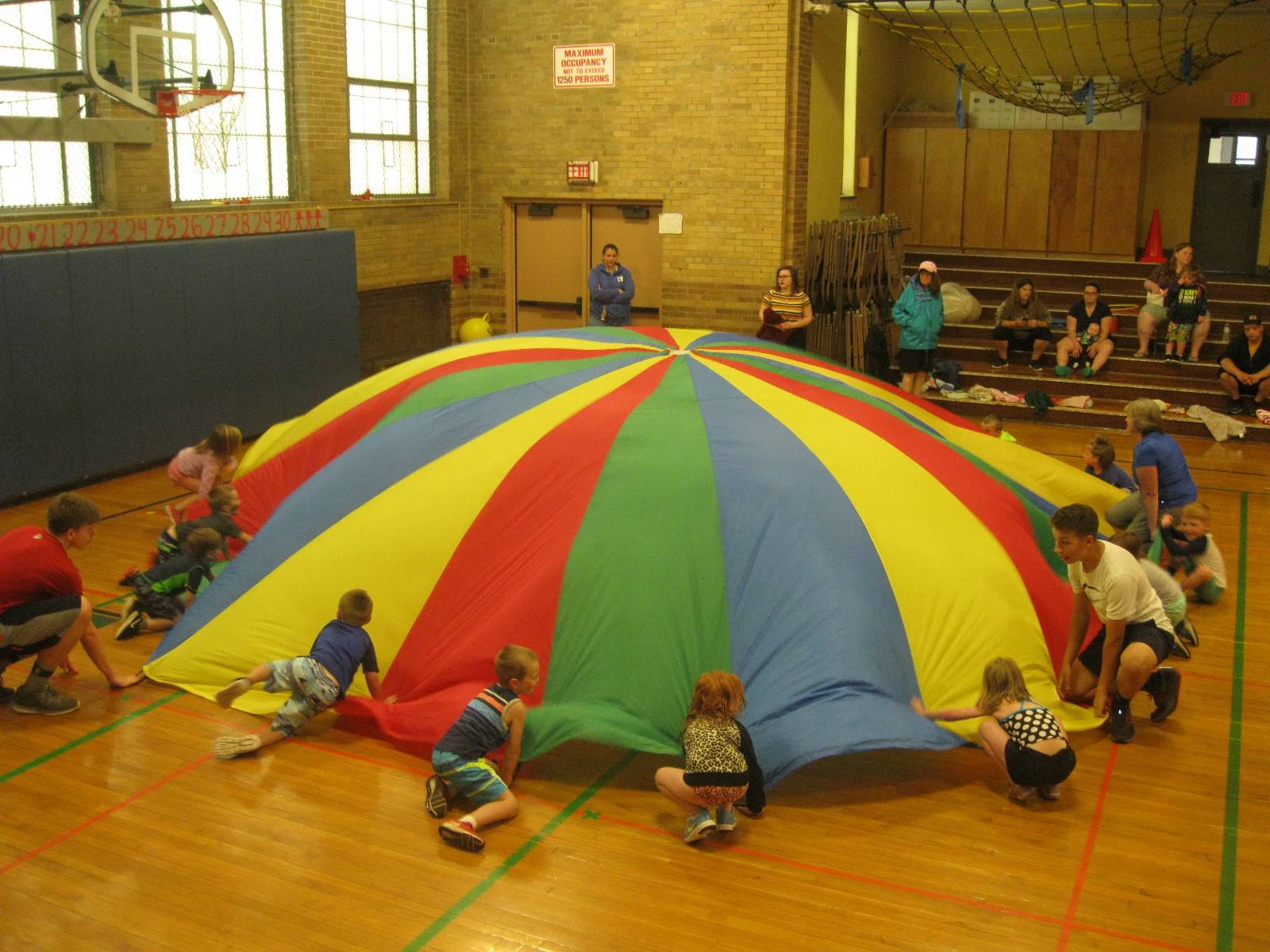 Students playing with parachute