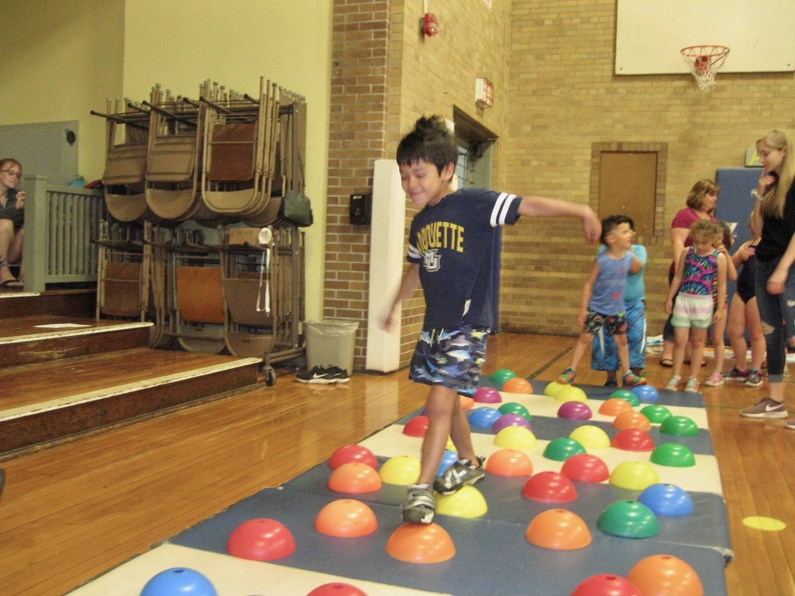 Student stepping across "stones"