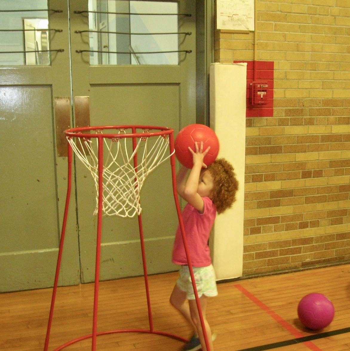 A student dunks a basketball in basket!