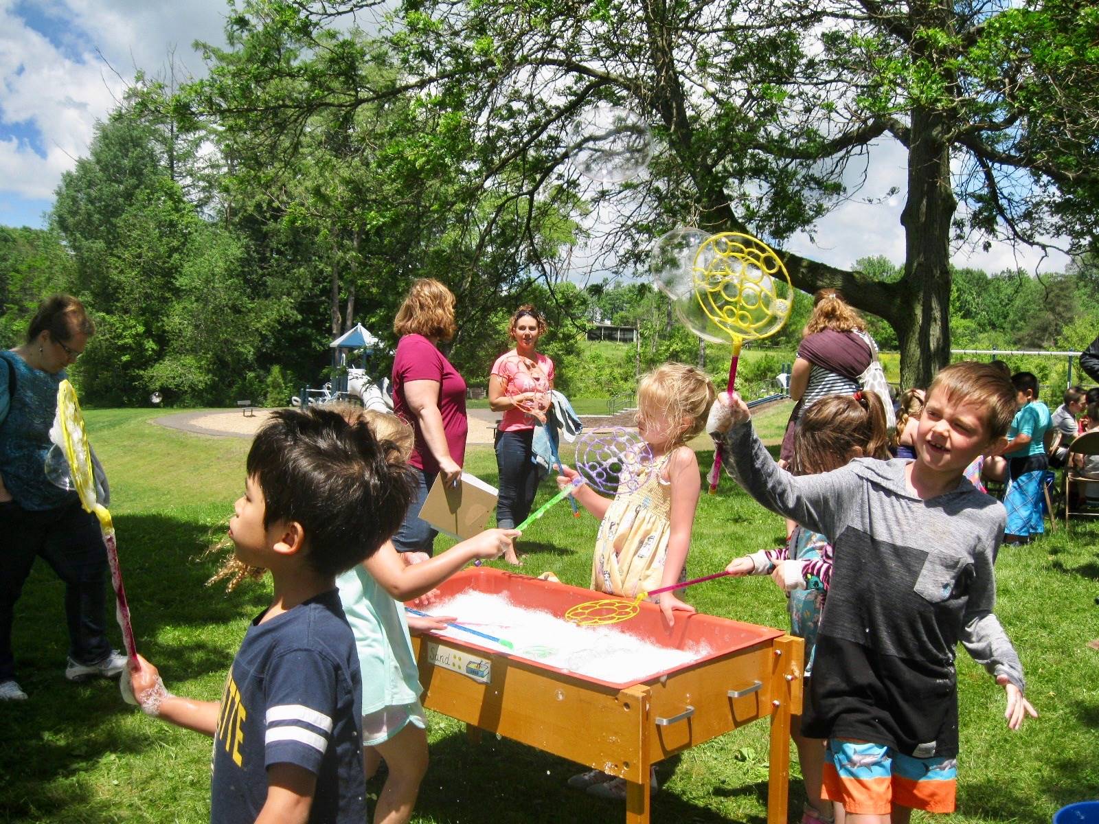 A group of students playing with bubbles.