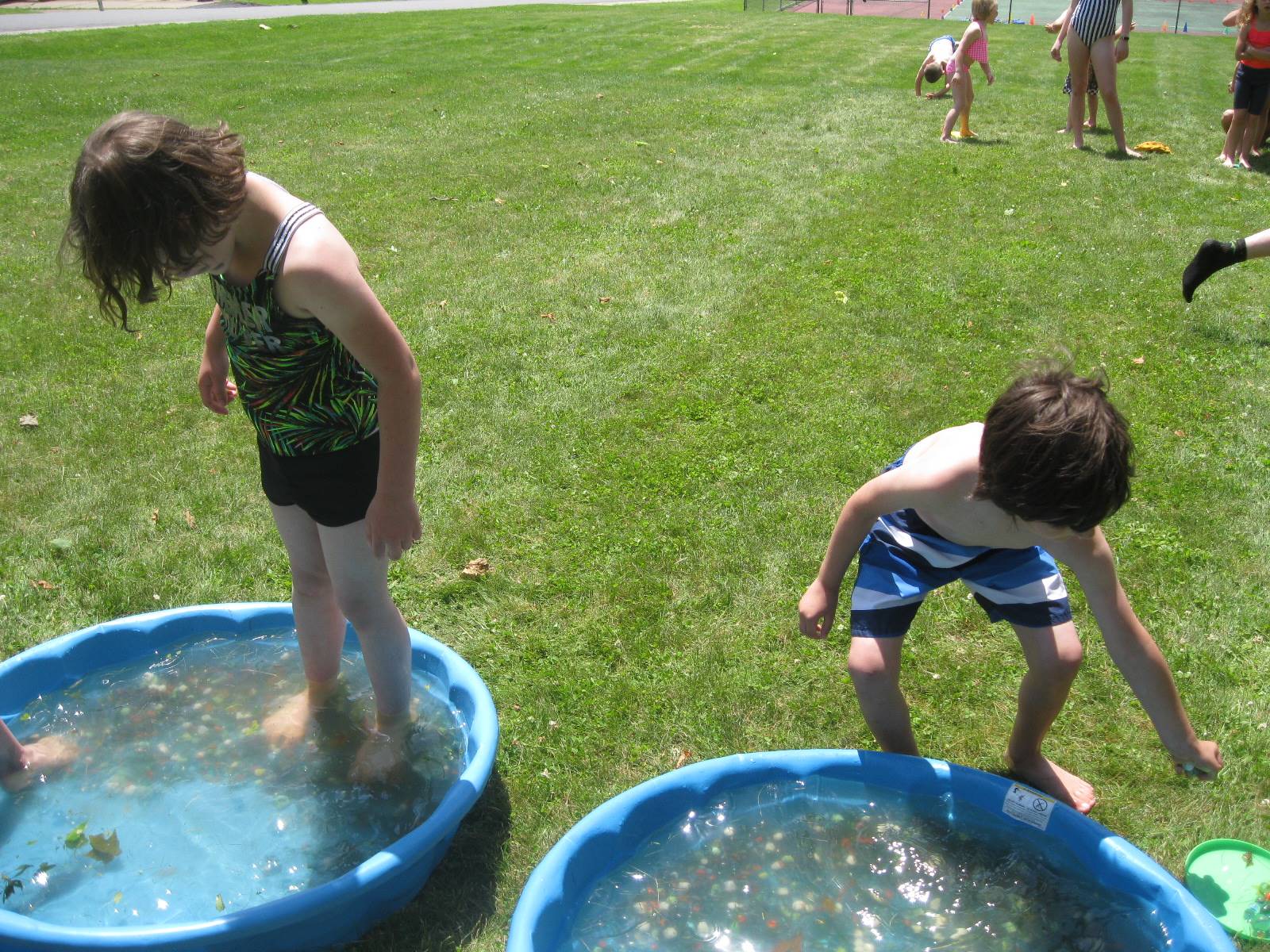 2 students in wading pools.