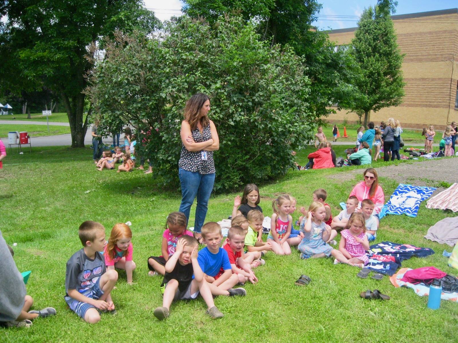 A group of students rest while waiting.