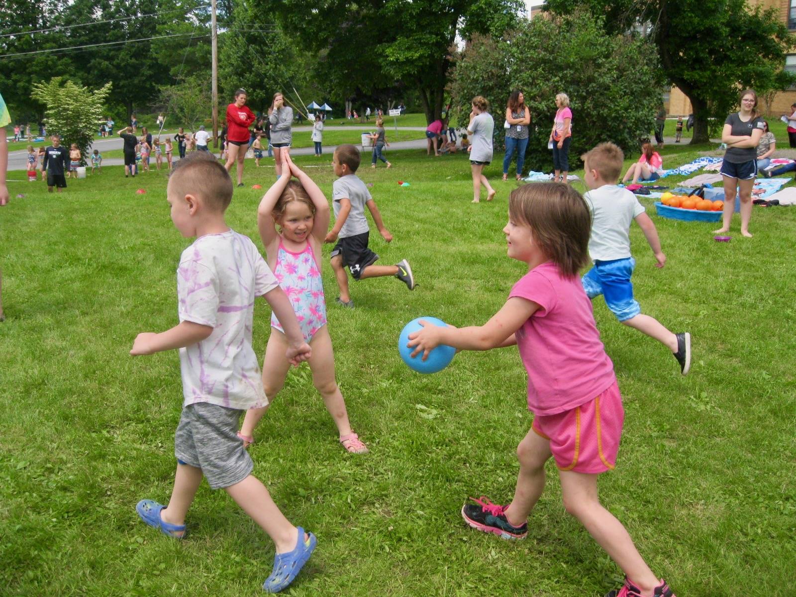 Students play tag with a ball.