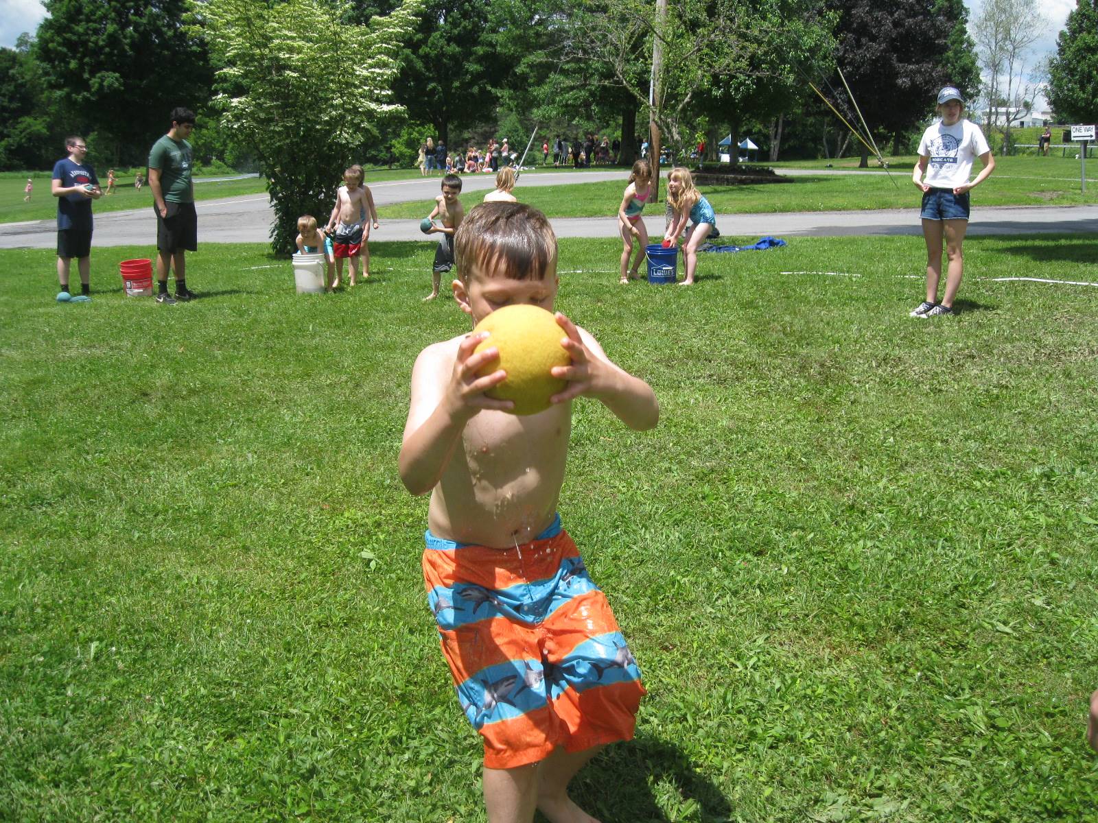 A student runs with a wet sponge.