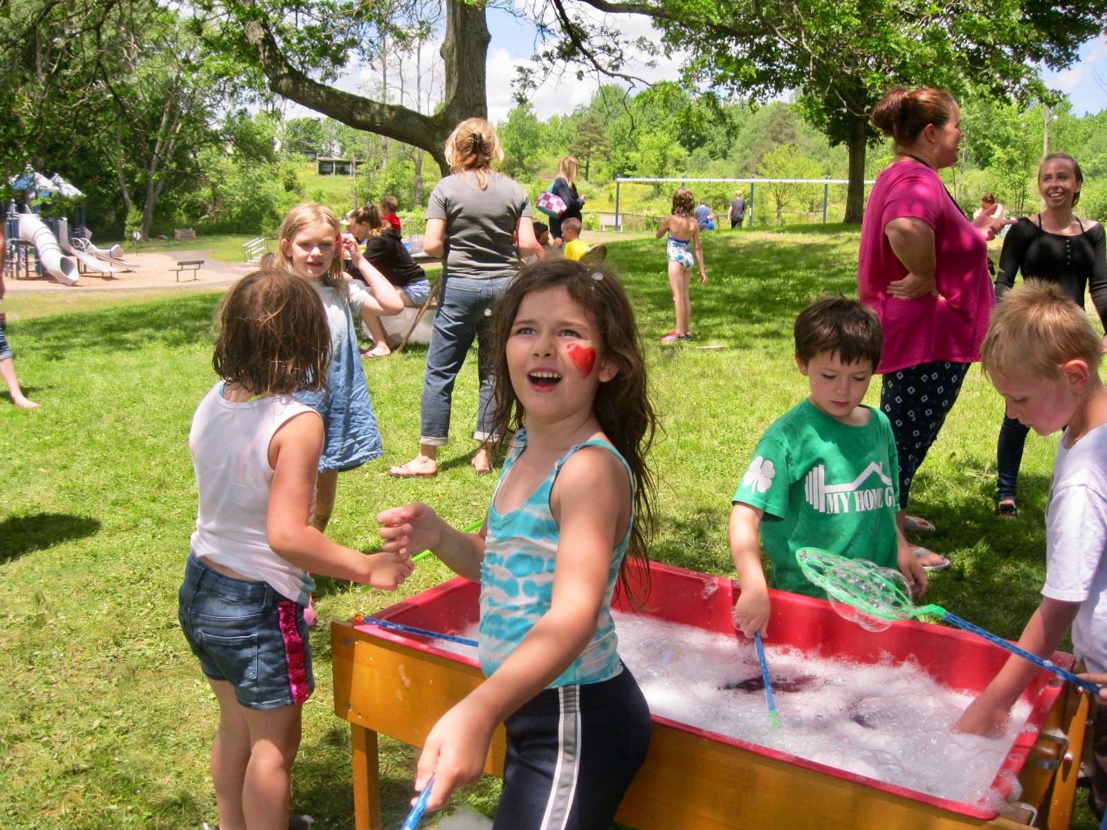 Students play with bubbles.