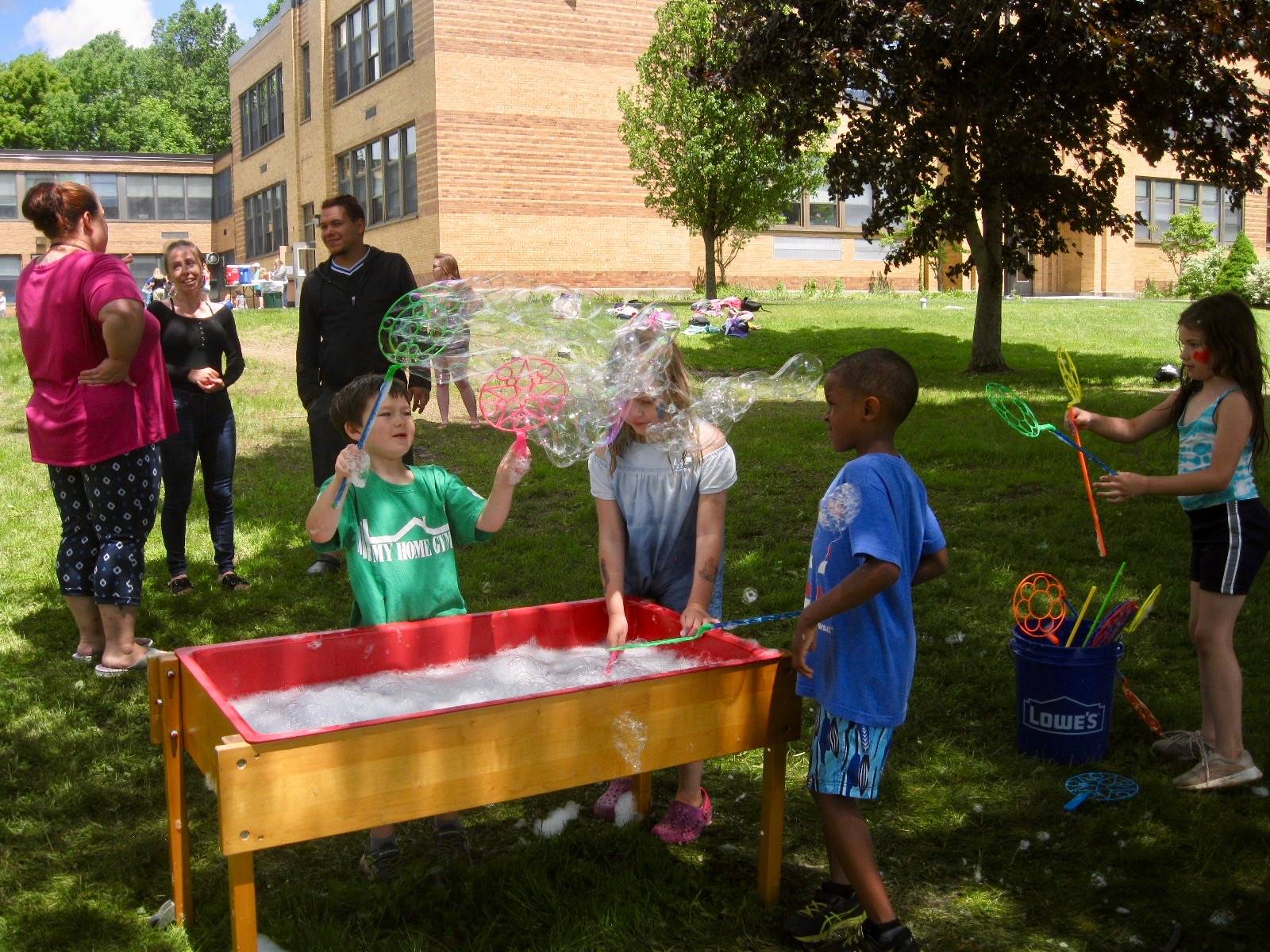 3 Students play with bubbles.