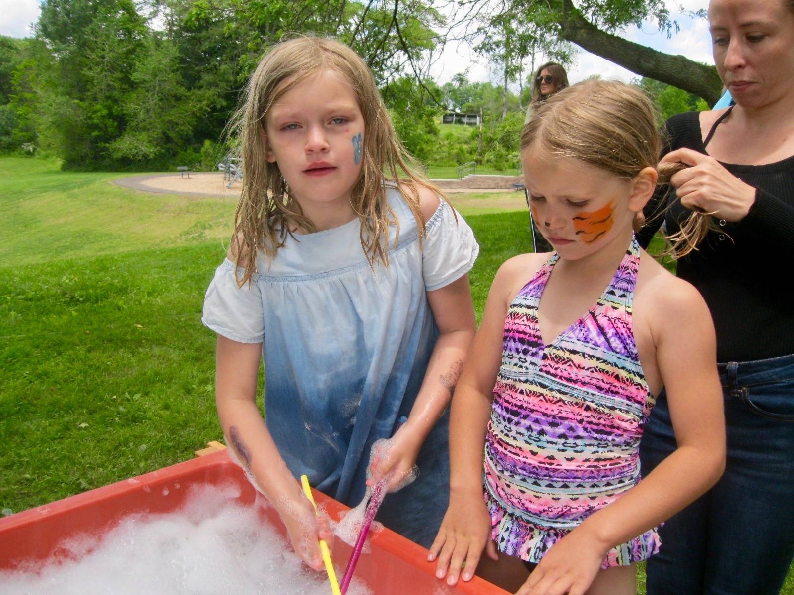 2 Students play with bubbles.
