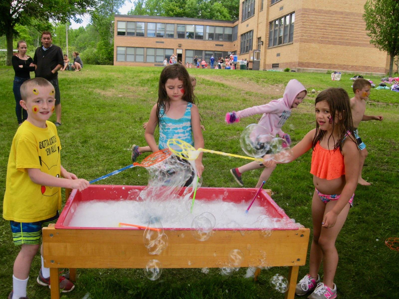 3 Students play with bubbles.