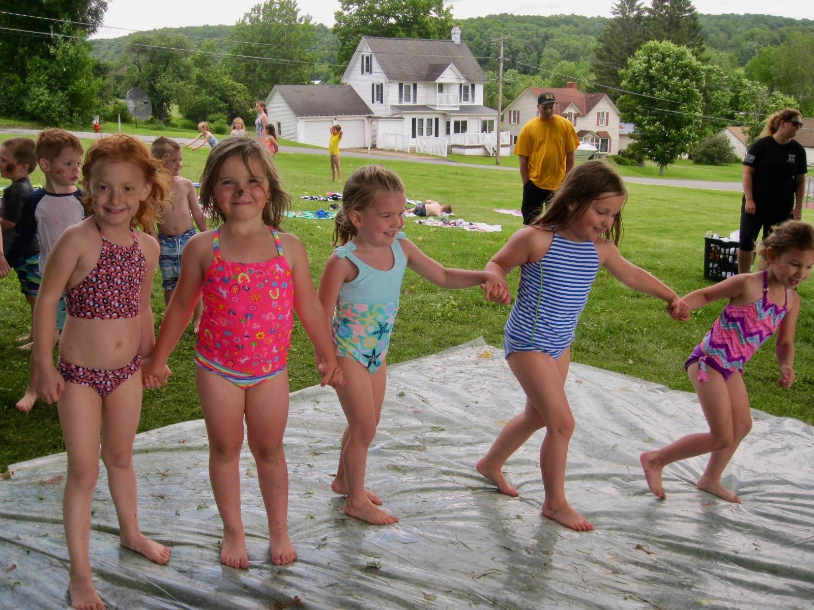 A group of 5 friends on water slide.