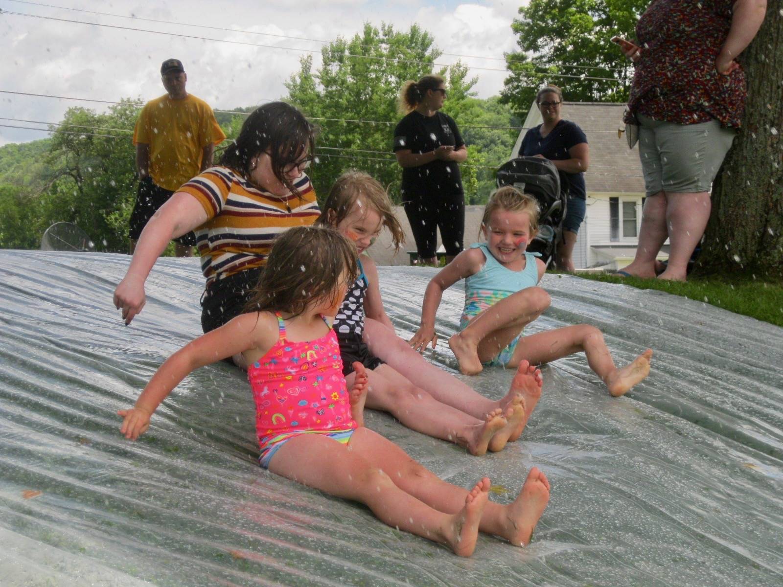 A group of student at top of water slide.