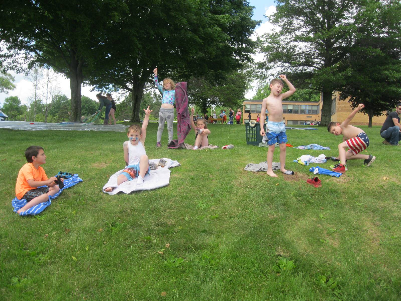 Students rest at the end of play day.