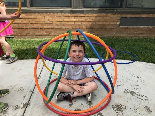 A student gets creative with hula hoops!