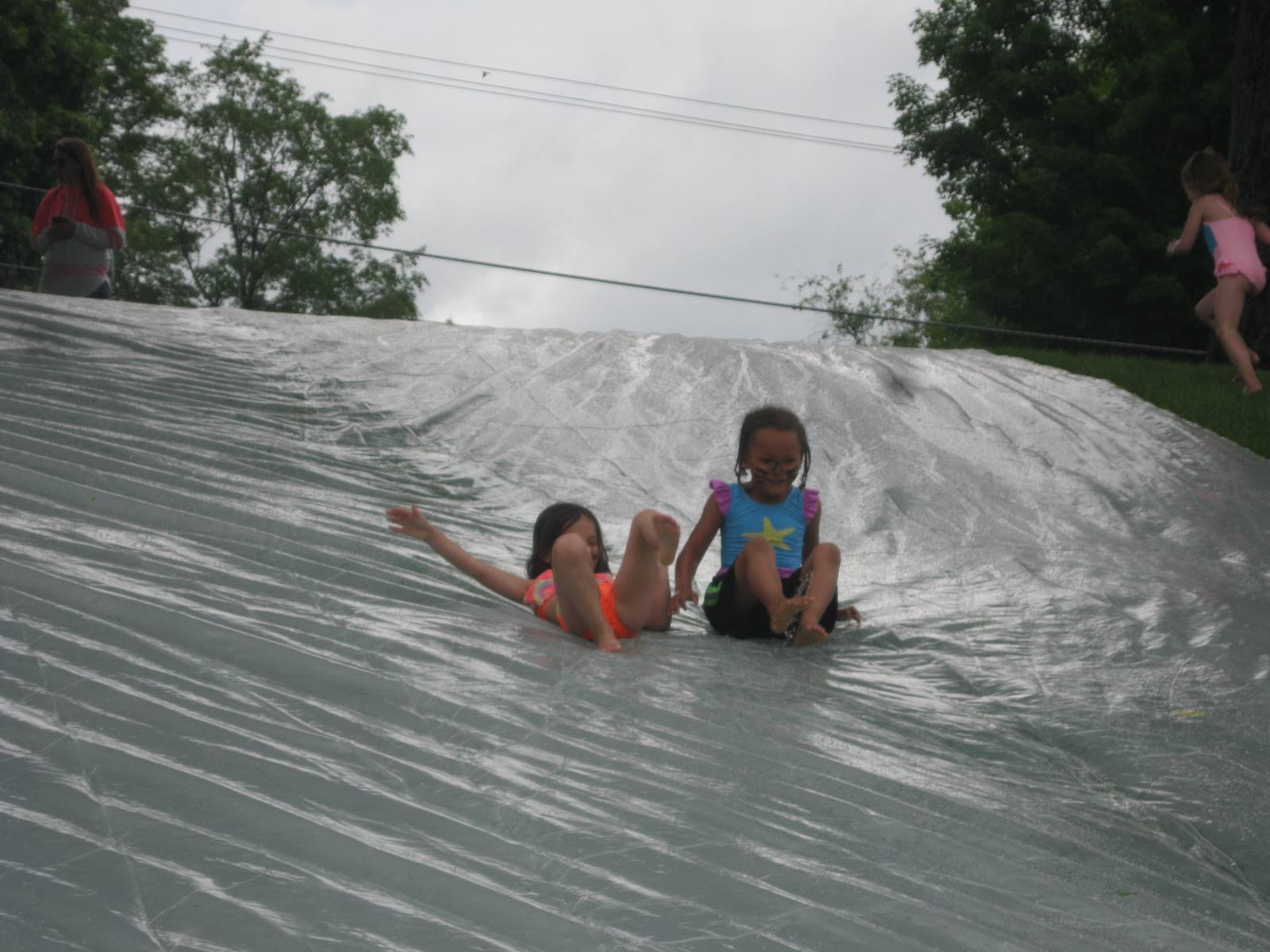 2 students on water slide