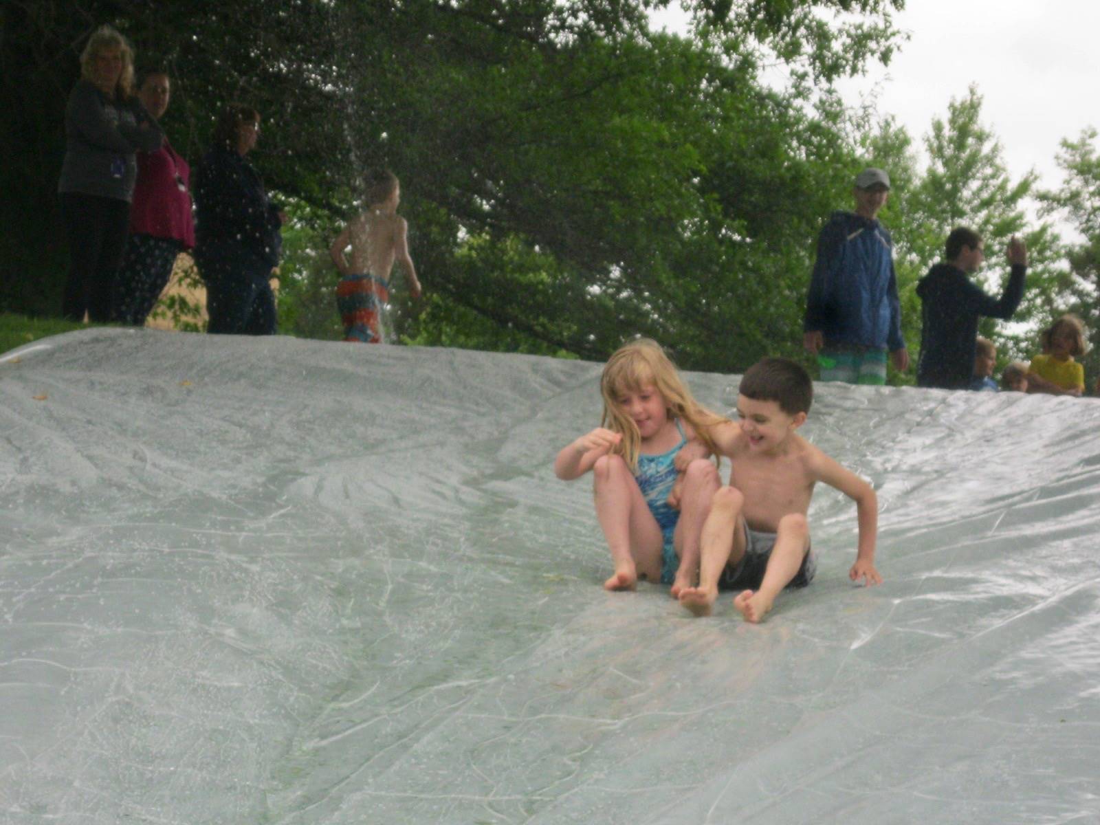 2 students on water slide