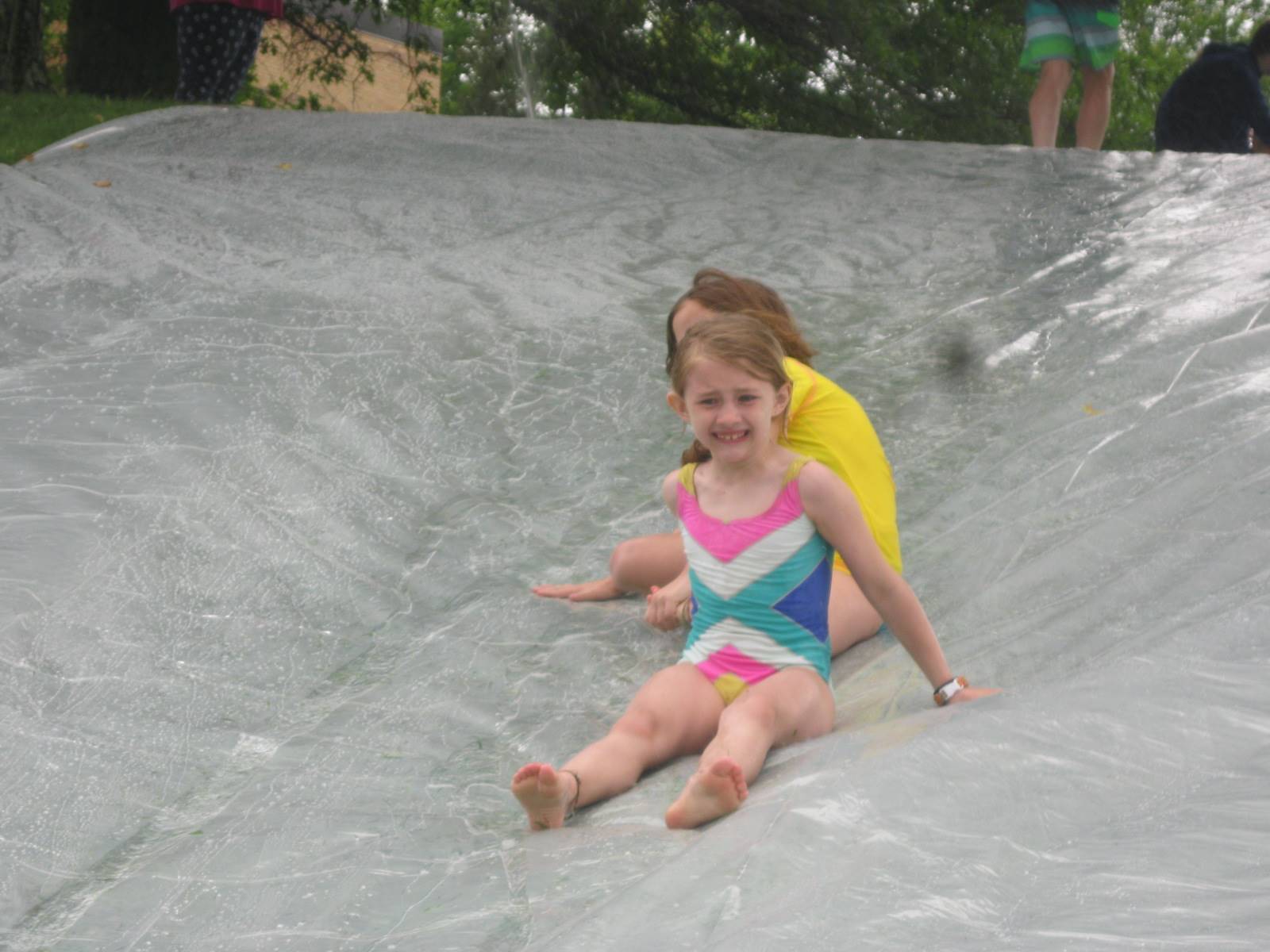 2 students on water slide