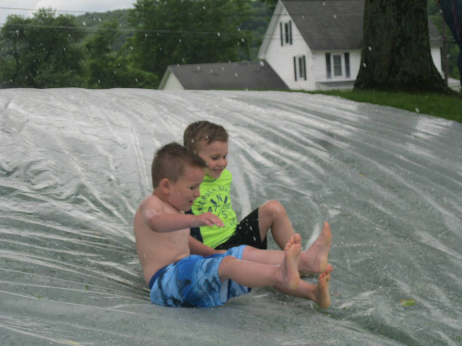 2 students on water slide