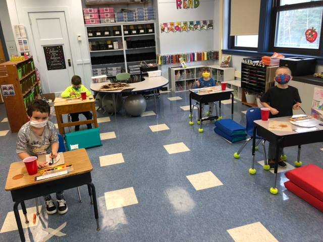 students work on thanksgiving crafts.