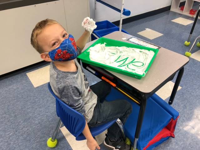 1 student writes "we" in shaving cream!