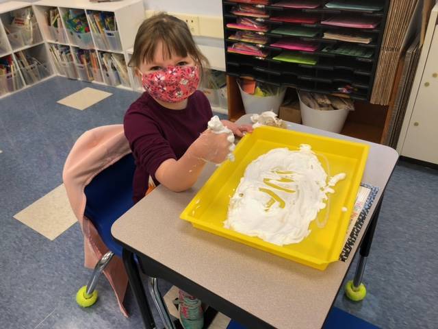 1 student writes "M" in shaving cream!