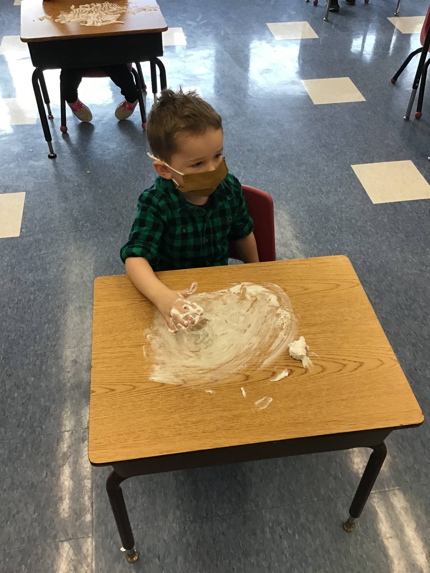 student draws emotions in shaving cream!