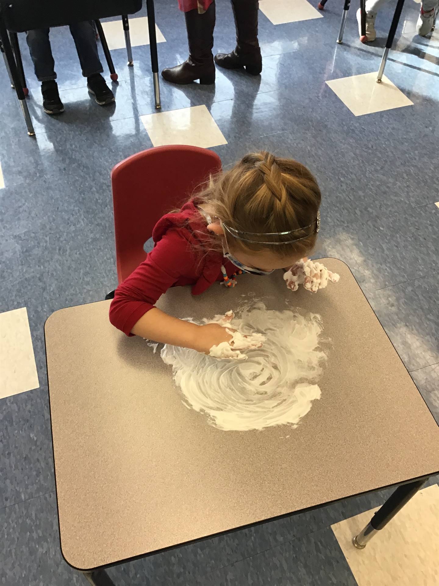 student draws happy face in shaving cream!