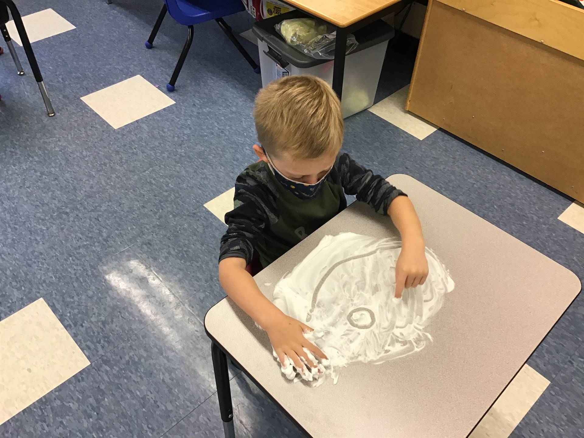 student draws emotions in shaving cream!