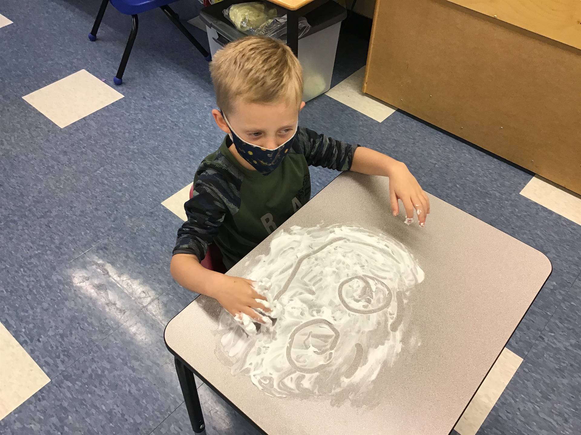 student draws emotions in shaving cream!