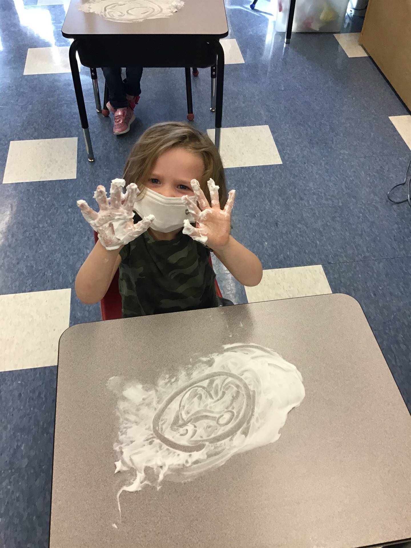 student draws emotions in shaving cream!