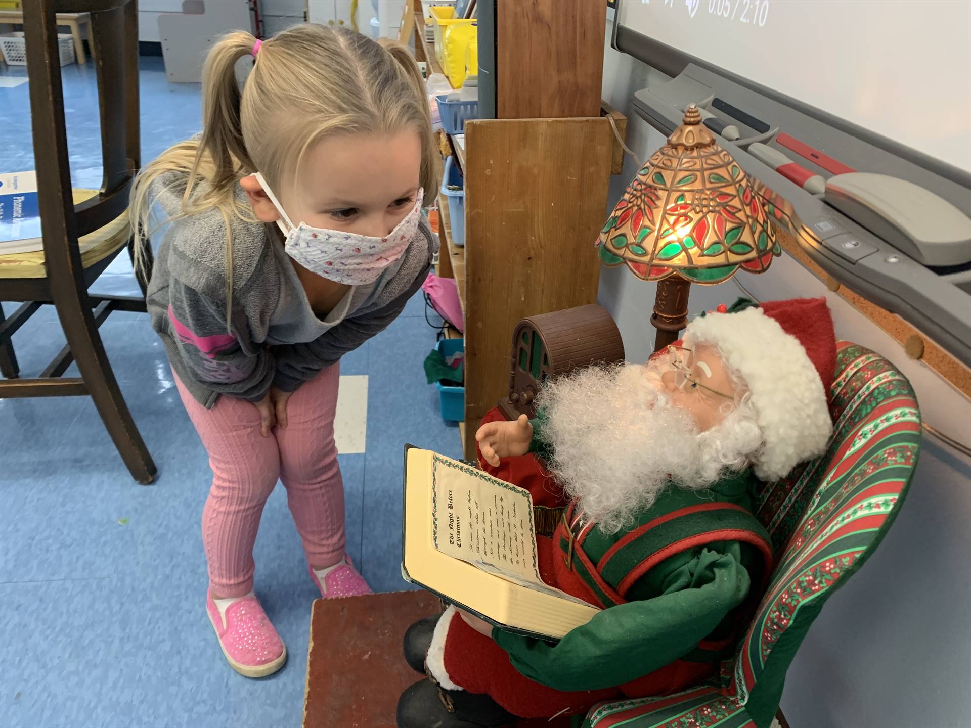 A student talks to Santa.