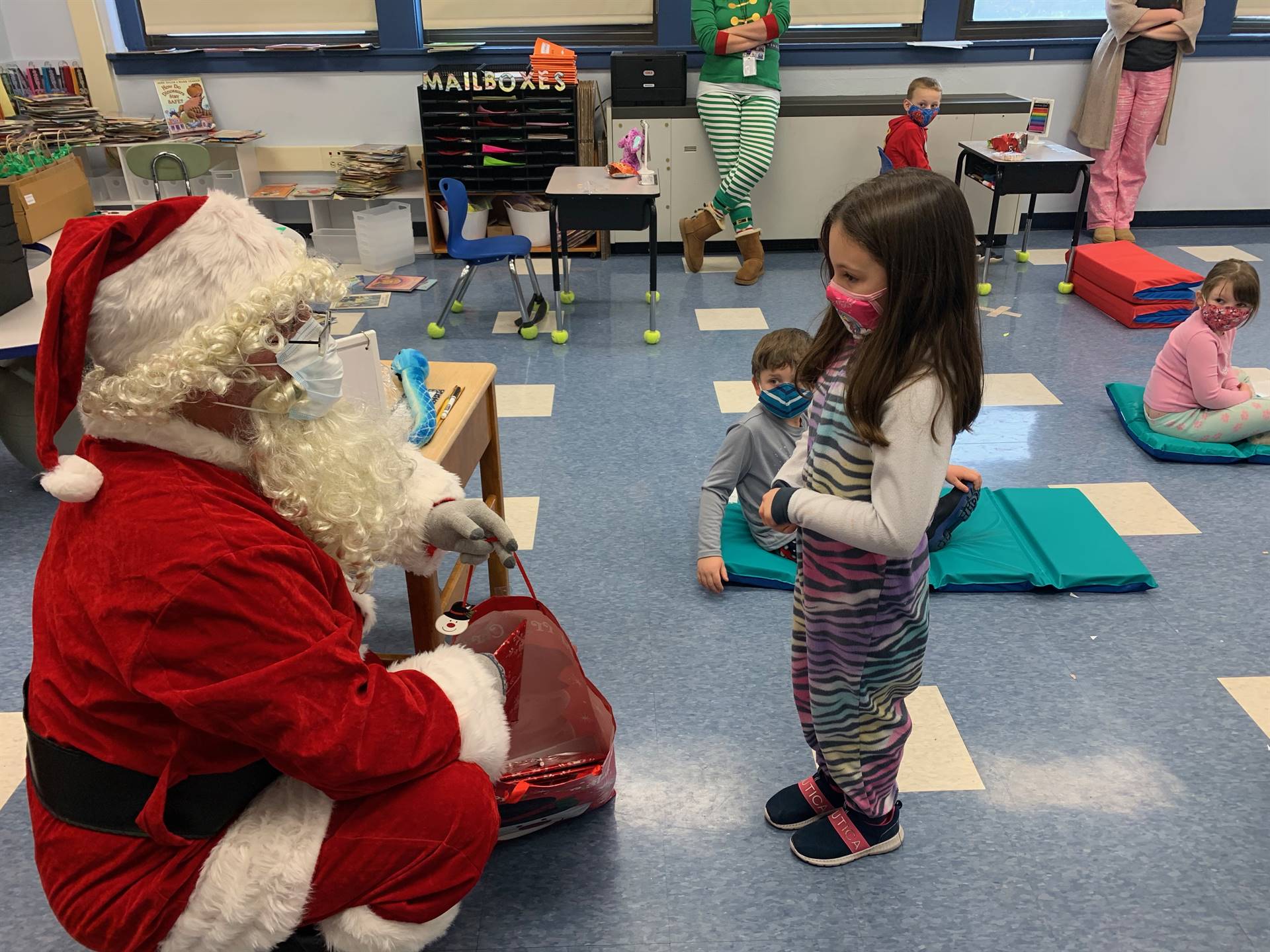 Santa talks with a student.