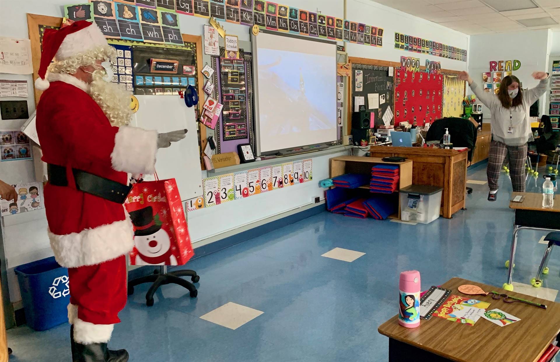 Santa gives a classroom a Ho Ho Ho and a teacher jumps for joy!