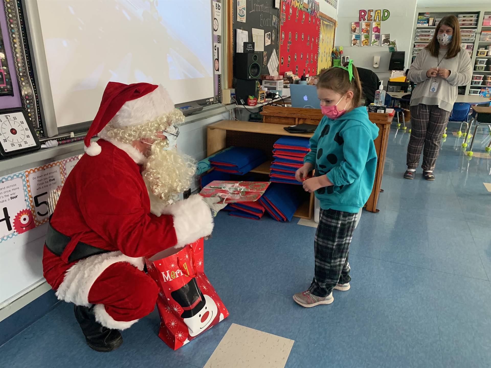 Santa talks to a student.