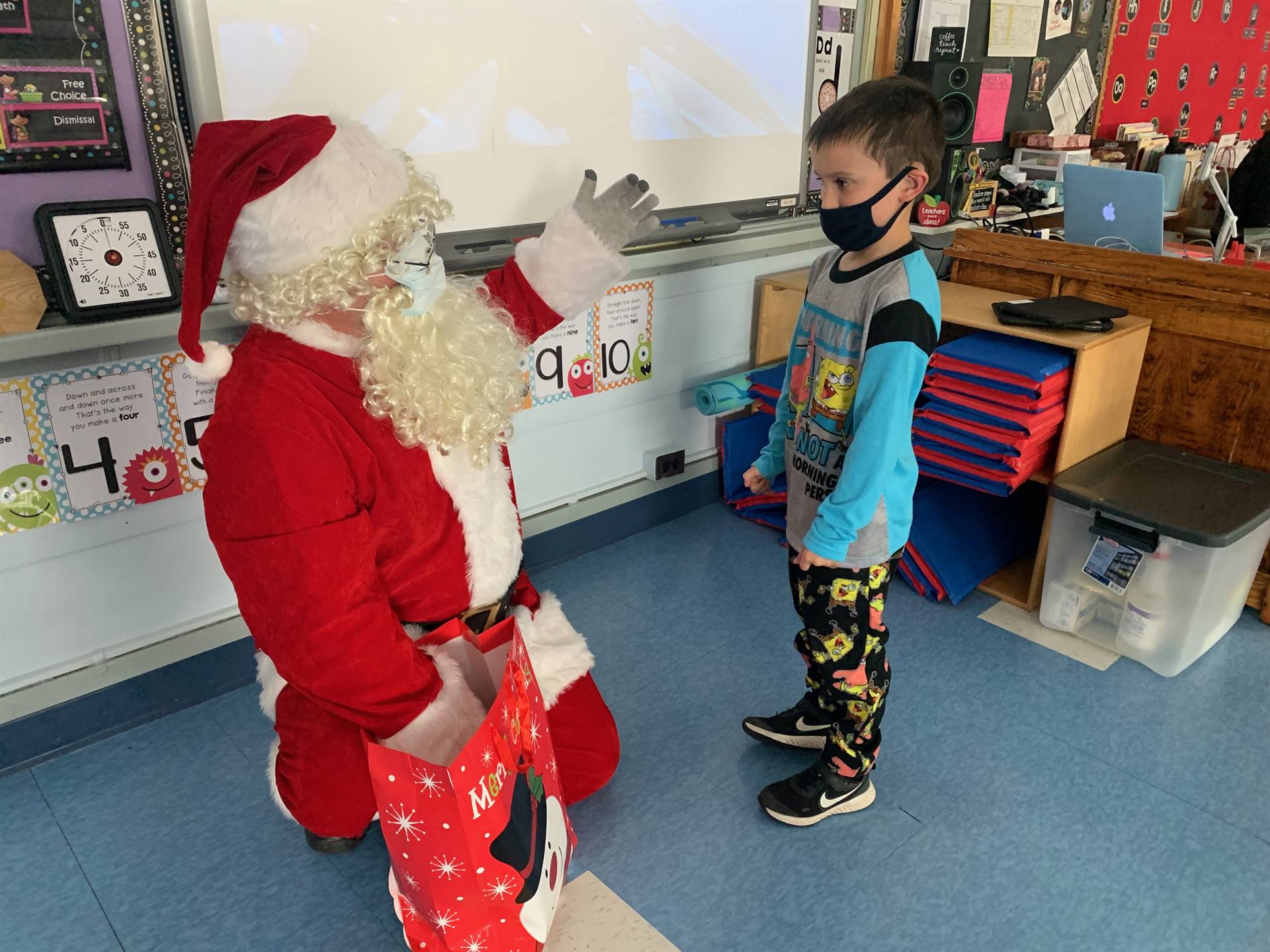 Santa talks to a student.
