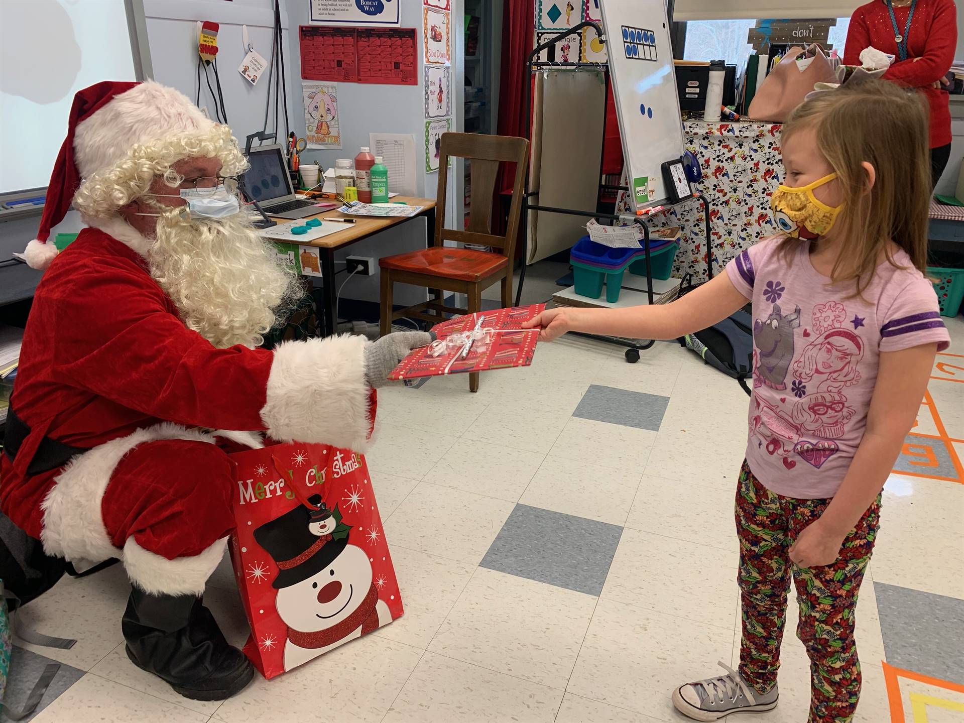 A students tells Santa she is good.