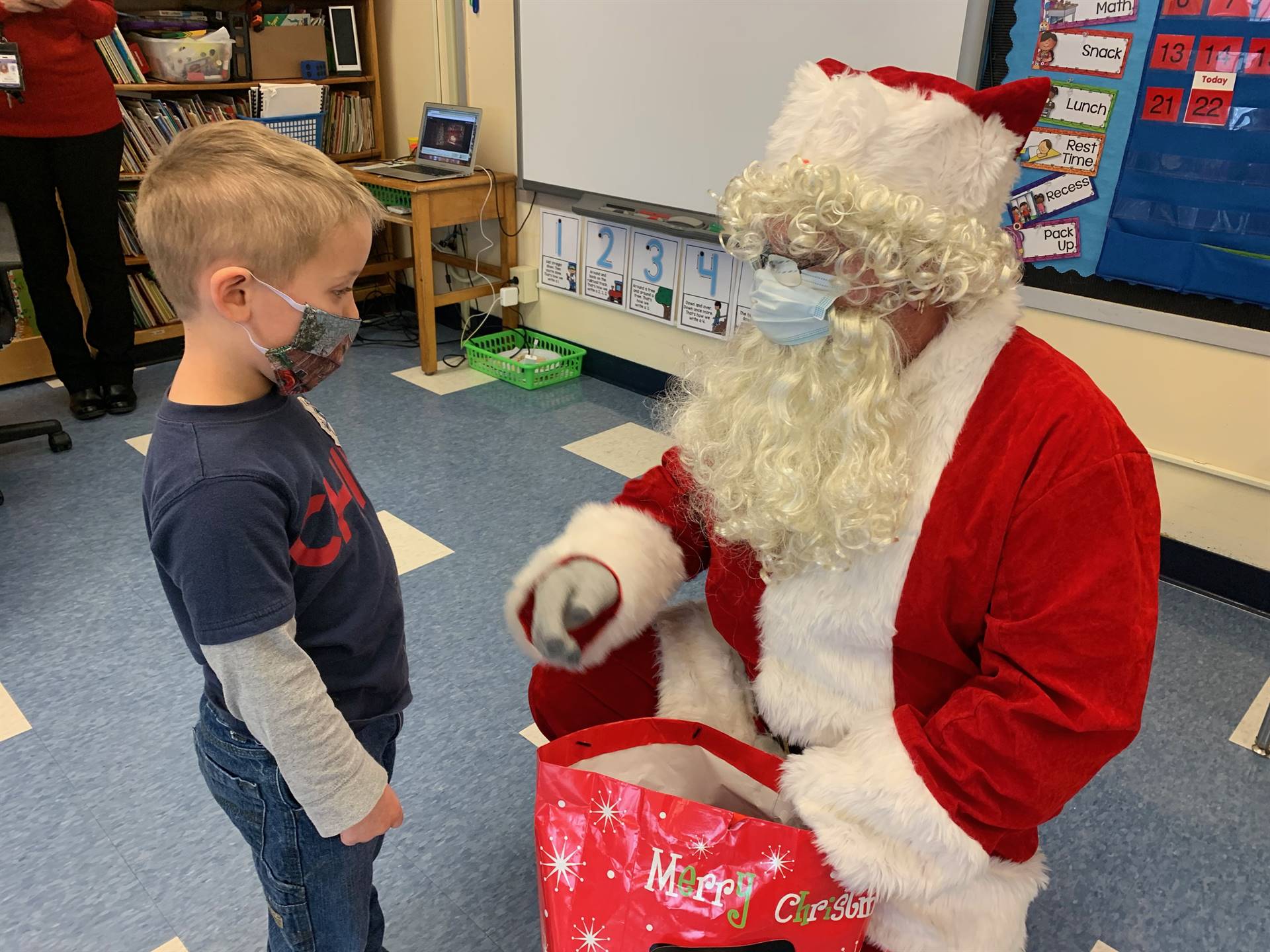 Santa and a student talk about being on the good list.