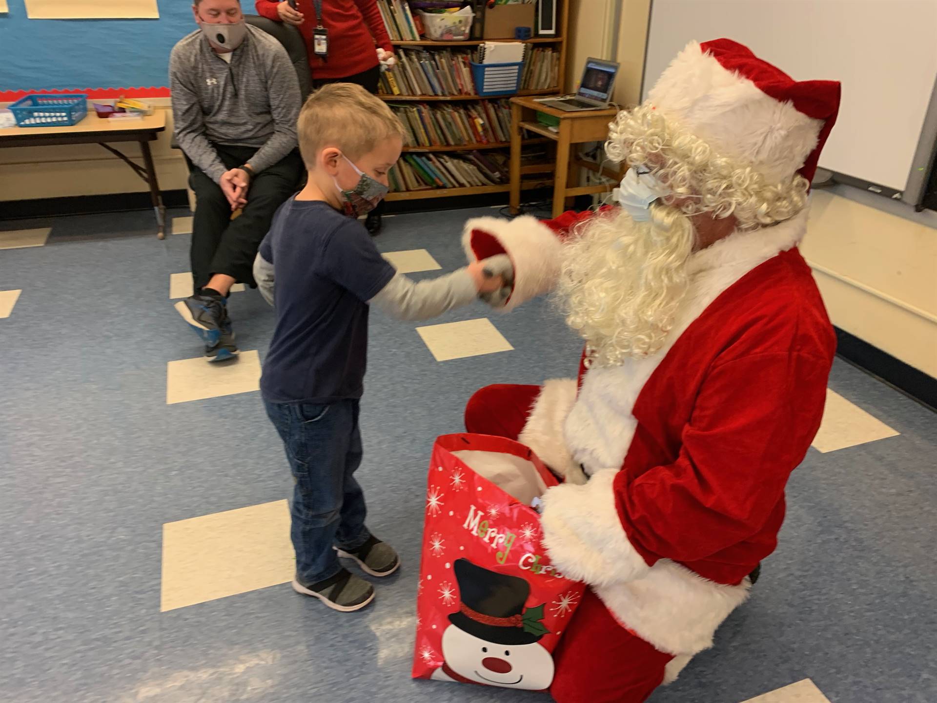 Santa gives a student the magic knuckle pound.