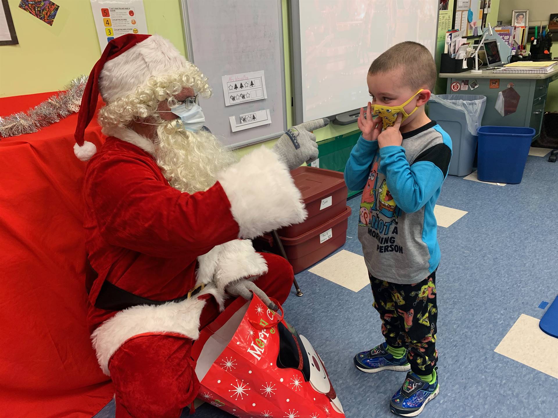 Santa talks to a student.