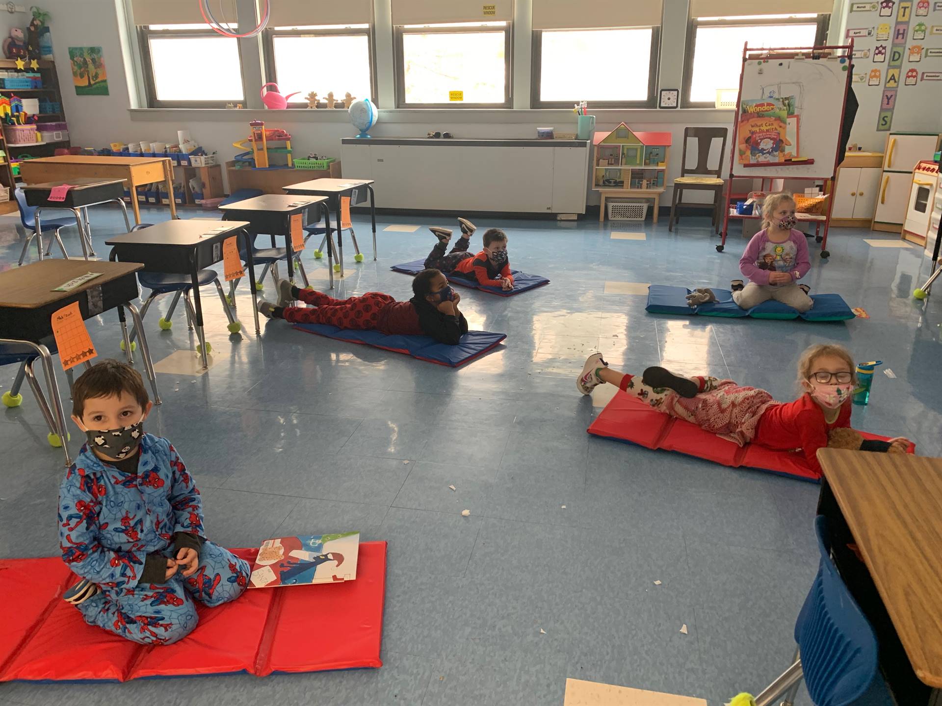 Students on floor  mats in PJs!